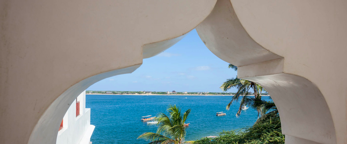 view of the Indian Ocean from an arch of the villa in Shella Beach on Lamu Island in Kenya